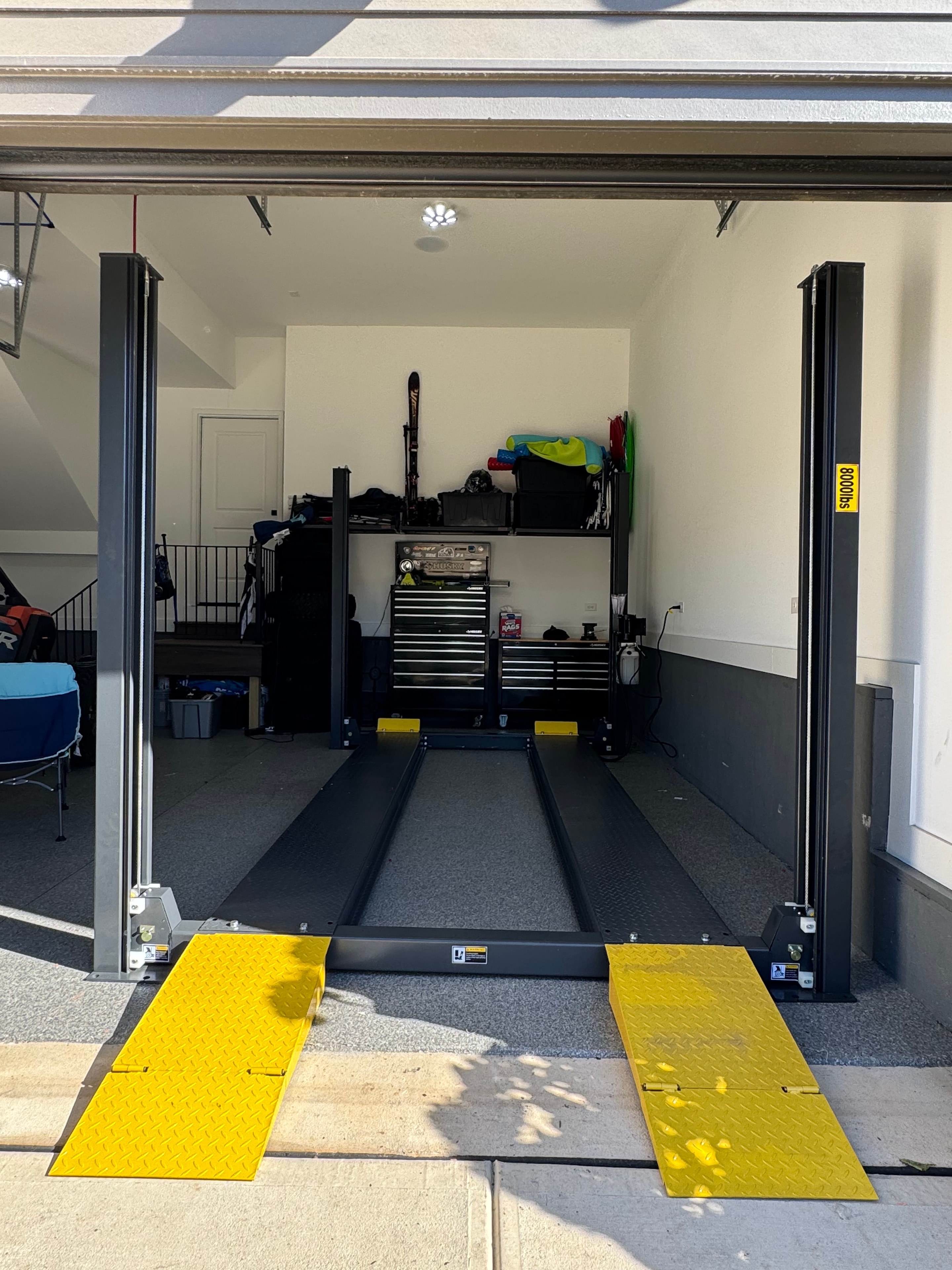 AMGO 408-P two-post lift installed in a garage