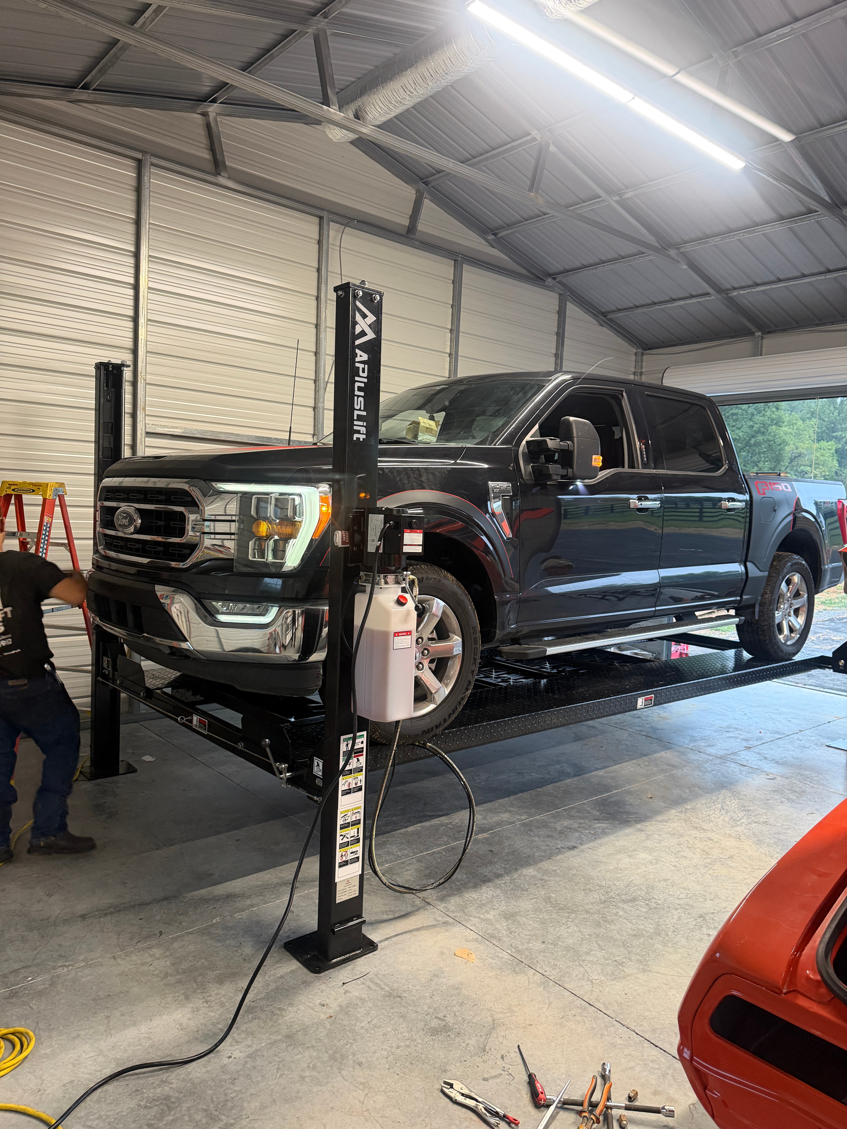 APlusLift AP-9XLT with an F-150 raised during installation