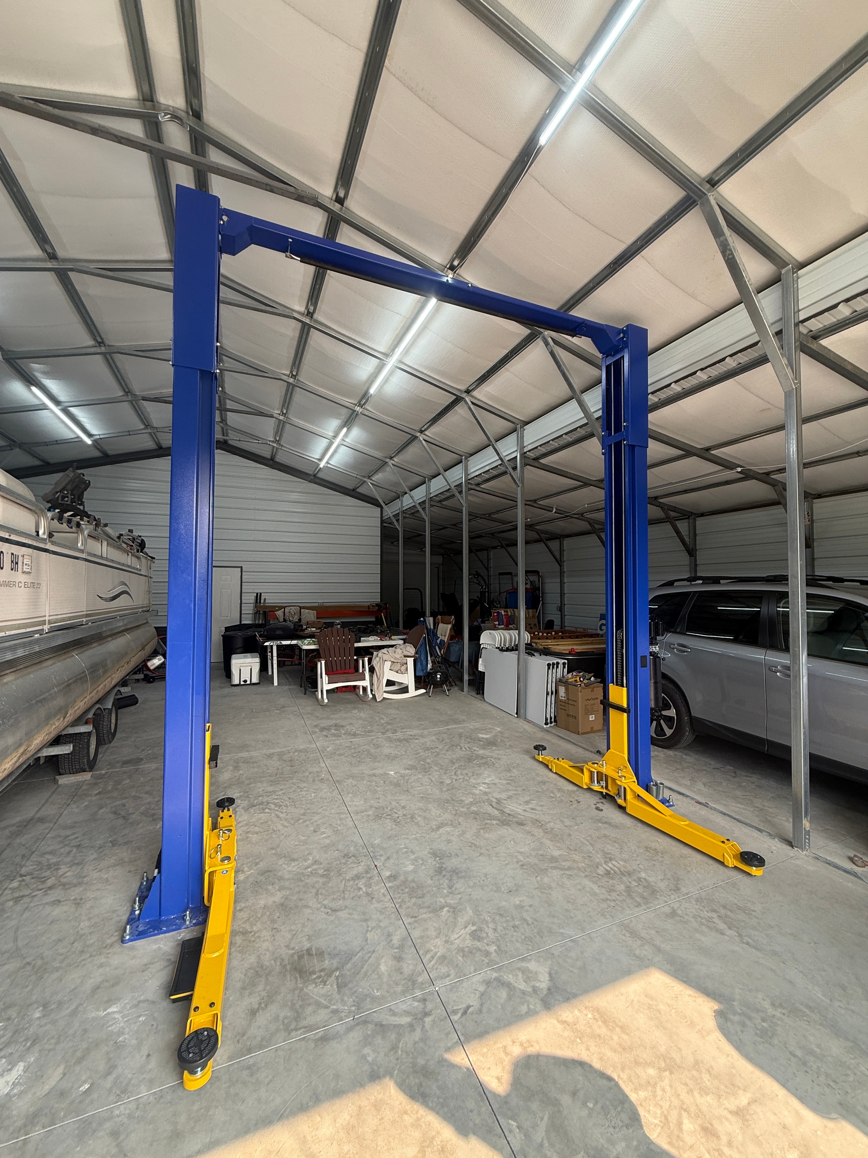 APlusLift KOH-series two-post lift installed in a garage